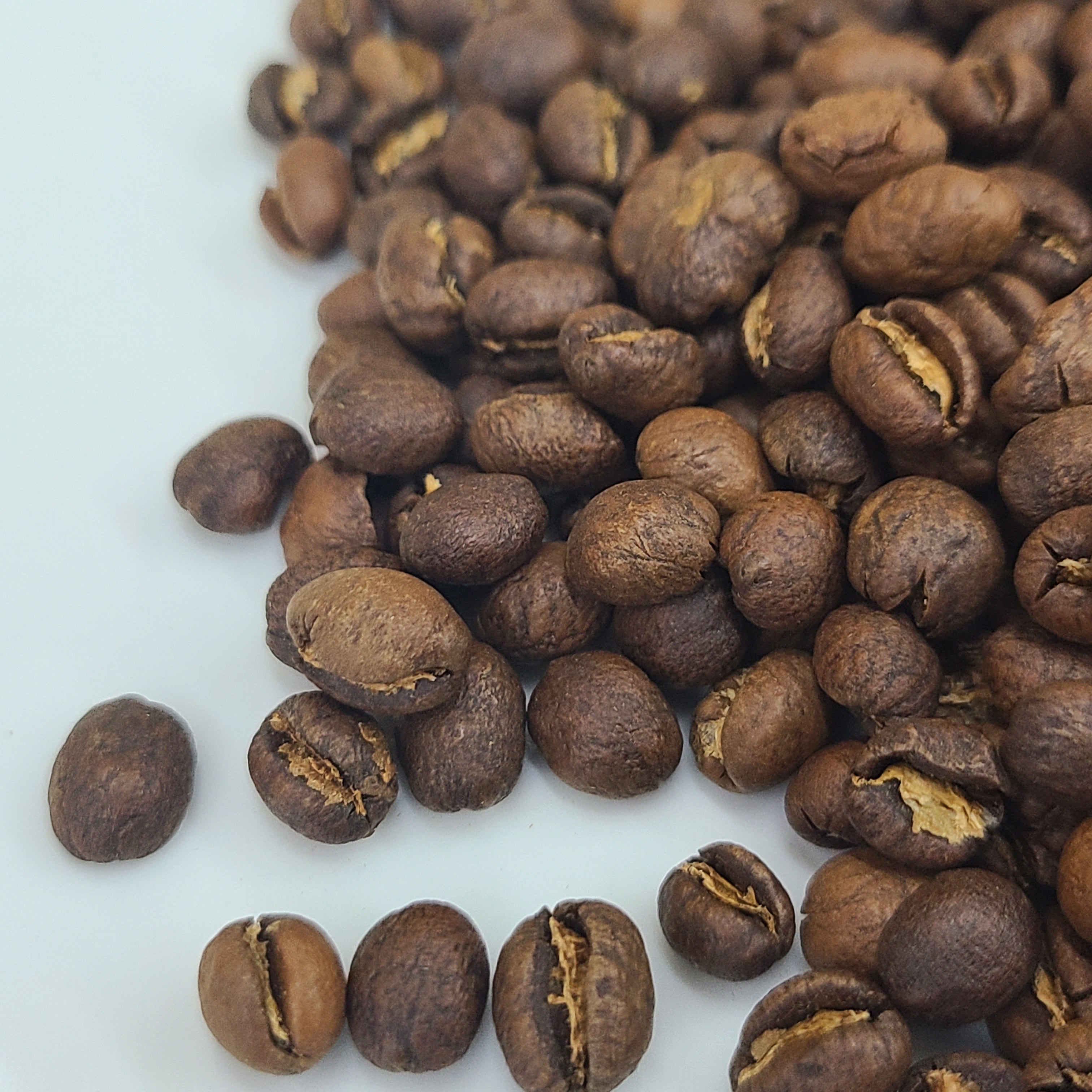 Roasted coffee beans on a white background
